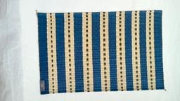 handmade natural fiber table mat blue black design
